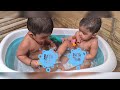 cute twins enjoying bath time