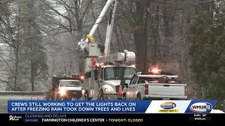 Crews work to restore power after outages caused by freezing rain
