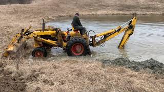 Case 580 Construction King Digging Out a Drainage Tile