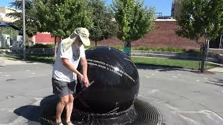 Water Sticks to a Spinning Sphere