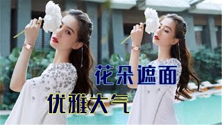 刘诗诗身着星钻露背长裙，珠链妆点发髻，展现迷人魅力