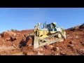 caterpillar d10t pushing rocks