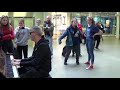 actor on the way to theatre approaches a street piano