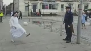 Nun shows off crazy football skills playing keepy uppy with policeman