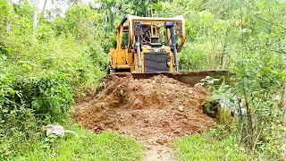 Overcoming the Challenges of Repairing Roads Near Rivers with the D6R XL Bulldozer