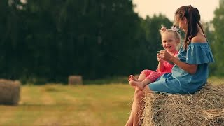 Mother And Daughter On Haystack Stock Video