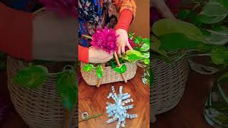 Fresh Flowers Arrangement with Houseplants in Wicker Basket.