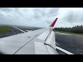 thai air asia airbus a320 landing at phuket airport wing view