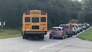 Bus 875 and 1314 leaving the lot