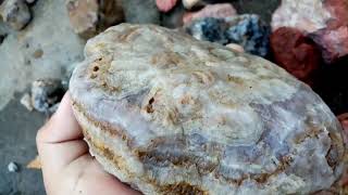 Looking for minerals and precious stones in the river Agates Quartz Jaspers and Rhodonite