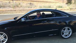 Mercedes Benz 2011 E550 COUPE driving in the country