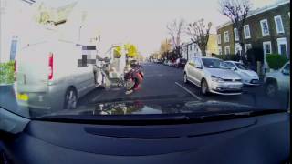 Cyclist knocked off bike by flying van door