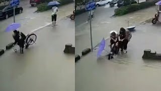 Passersby save bicyclist from deep puddle