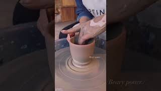 Wheel throwing marbled clay teacup