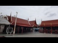 releasing birds at wat intharawihan thailand.