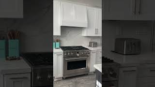 Calacatta Rocky Quartz Countertops and Backsplash