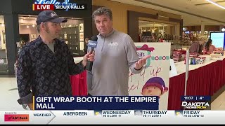 Dakota News Now team volunteers at Gift Wrap Booth