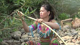 Primitive life - Ethnic girl make shelter tent and cooking - Survival alone in forest