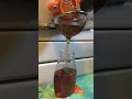 this is how i bottle honey through a stainless screen to catch wax straight to the bottle. honey