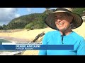 north shore residents roll up their sleeves to clean up deteriorating sand burritos from the beac...