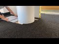 cutting carpet tiles into round columns with a nail and string guide