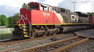 CN 8018, 8811 speeding East with BLE aggregate open-top hopper freight train in Vicksburg, MI