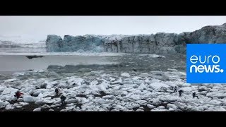 Watch: A large wave makes tourists flee after Icelandic glacier collapse