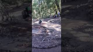 Guy Watching ATV Drive Through Ditch Slips and Falls Into Muddy Water - 1250095