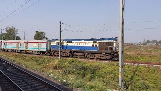 Parallel run of 13247 NJP Patna Capital Exp and Haldibari NJP DMU entering New Jalpaiguri Junction