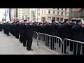 FDNY Members Salute As FDNY LT. Davidson Is Brought To St. Patricks Cathedral