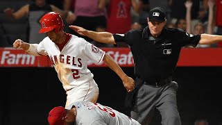 A Wild Pitch Lifts the Angels - Andrelton Simmons crosses home on Luis Garcia's wil