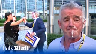 Belgian environmental activists splatter Ryanair boss Michael O'Leary with cream pies