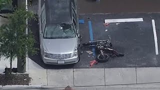 Motorcyclist crashes into hearse outside of funeral home