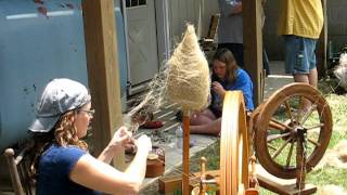 Spinning flax on wheel