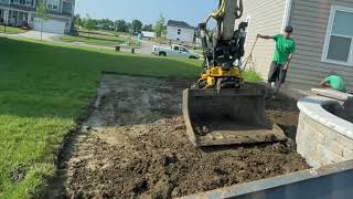 Engcon tilt rotator on Takeuchi tb290 Backfilling a retaining wall and grading topsoil