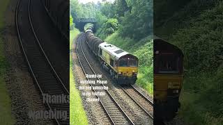 DB Cargo Class 66119 in EWS livery making its run from Round Oak to Margam at Kidderminster 12.06.23