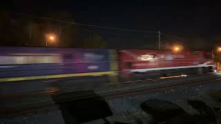 Pacific Nationals NR110 with Ghan livery and NR10,NR8 lead 5BS6 through Greenbank 12/12/24