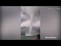 onlookers watch in awe as massive tornado spins nearby