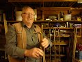 demonstrating how a thumb stick is made. its a natural walking stick series 7