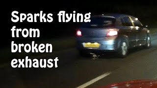 Broken exhaust dragging on the road - sparks flying