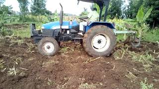 New Holland TT 55 At  the field