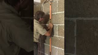 Cutting a groove in HempBLOCK wall for electrical services.