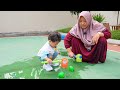 ARACELLI SEPARATES WATER BALLOONS AND POPS THEM - Learn Color With Balloons