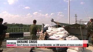 Ukrainian forces close in on Donetsk, as UN warns of mass exodus