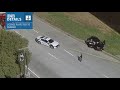 Police exchange fire with a murder suspect during a police chase