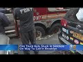 FDNY truck gets stuck in sinkhole on way to call in Brooklyn