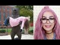 PEOPLE MESSING AROUND WITH STATUES