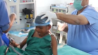 Boy trying to run away from surgery then later given Anesthesia