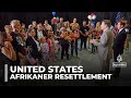 Trump administration welcomes 59 white South Africans as refugees to the US