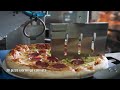 a fully robotic pizzeria from the israeli company hyper robotics whose machine cooks prepare up to